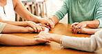 Holding hands, home and women with support, friends and comfort with empathy, grief and prayer. Closeup, spiritual and mature people with sympathy, care and mourning for loss, religion and consoling