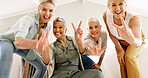 Excited, hand gesture and portrait of old women in home together for bonding or fun from below. Energy, peace sign and thumbs up emoji with group of happy senior friends in apartment for retirement
