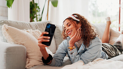 Buy stock photo Smile, woman and selfie on sofa at house for photography, social media post and capture moment. Happy, relax and photo on couch for profile picture update, content creator and memory in living room