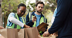Clipboard, volunteers or man with donation list in park, community service or packaging for charity drive. Teamwork, non profit or people with paper bag for food security crisis, supplies or outdoor