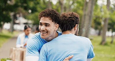 Buy stock photo Happy man, hug or volunteer with embrace for community service or commitment together in park. Male person, team or NGO with smile, trust or support for global outreach, charity or donation in nature
