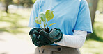 Compost, plant and hands of volunteer in nature for sustainability community service. Non profit, outdoor and ngo worker with fertilizer for leaf growth with charity event at park for earth day.