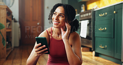 Buy stock photo Phone, thinking and yoga with woman on floor in kitchen of home to search instructions for exercise. App, fitness and idea with happy yogi person in apartment for holistic health or wellness info