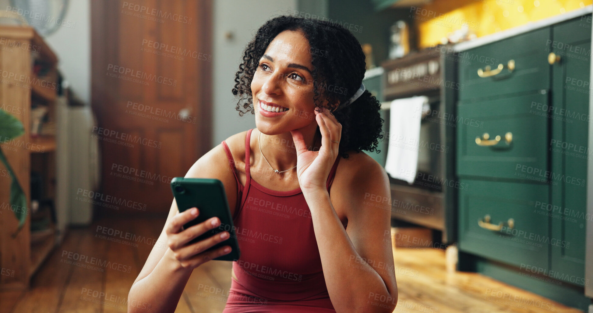Buy stock photo Phone, thinking and yoga with woman on floor in kitchen of home to search instructions for exercise. App, fitness and idea with happy yogi person in apartment for holistic health or wellness info