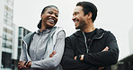 Fitness, couple and laughing with arms crossed in city for workout progress, wellness and support. Active relationship, interracial people or happy outdoor for urban exercise, bonding or cardio break