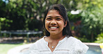 Smile, portrait and outdoor with child at swimming pool for summer vacation, weekend break and youth. Happiness, relax and backyard with girl in garden of house for holiday, calm and neighborhood