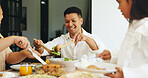 Family dinner, child and happy man serving in dining room, holiday bonding or sharing food for meal time. Hungry, girl and people at table in home for supper, eating together or give helping of salad
