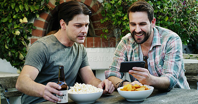 Buy stock photo Phone, friends and men with beer in backyard for streaming sports game, relax and bonding together. Alcohol, mobile and happy people in garden with popcorn, chips and watch online match to hang out