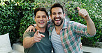 Happy men, portrait and friends with celebration for bonding, social gathering or get together. Excited, male people or smile with thumbs up or pointing for friendship or entertainment in garden