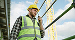 Radio, discussion or supervisor outdoor for construction, plan or instruction in project management. Architecture, helmet or man with tech, infrastructure progress or communication in site inspection