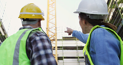 Buy stock photo Construction, pointing and back of people in city for building project, infrastructure or planning. Civil engineering, team and low angle of workers for renovation, property development or inspection