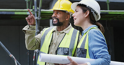 Buy stock photo Woman, man and point with discussion at construction site, helmet or planning for property expansion. People, architect and inspection for building project, talk and blueprint for real estate in city