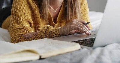 Buy stock photo Hands, laptop and book for student on bed, home and online course with notes, study and scholarship. Person, computer and scroll with assessment, elearning and education with virtual college project