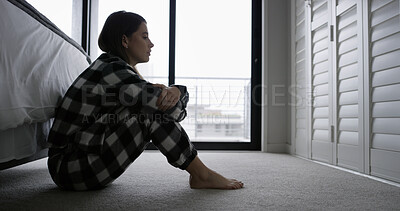 Buy stock photo Sad, woman and thinking on bedroom floor with break up reflection, regret memory and mental health. Stress, person with depression and unhappy in home with overthinking, disappointed and broken heart