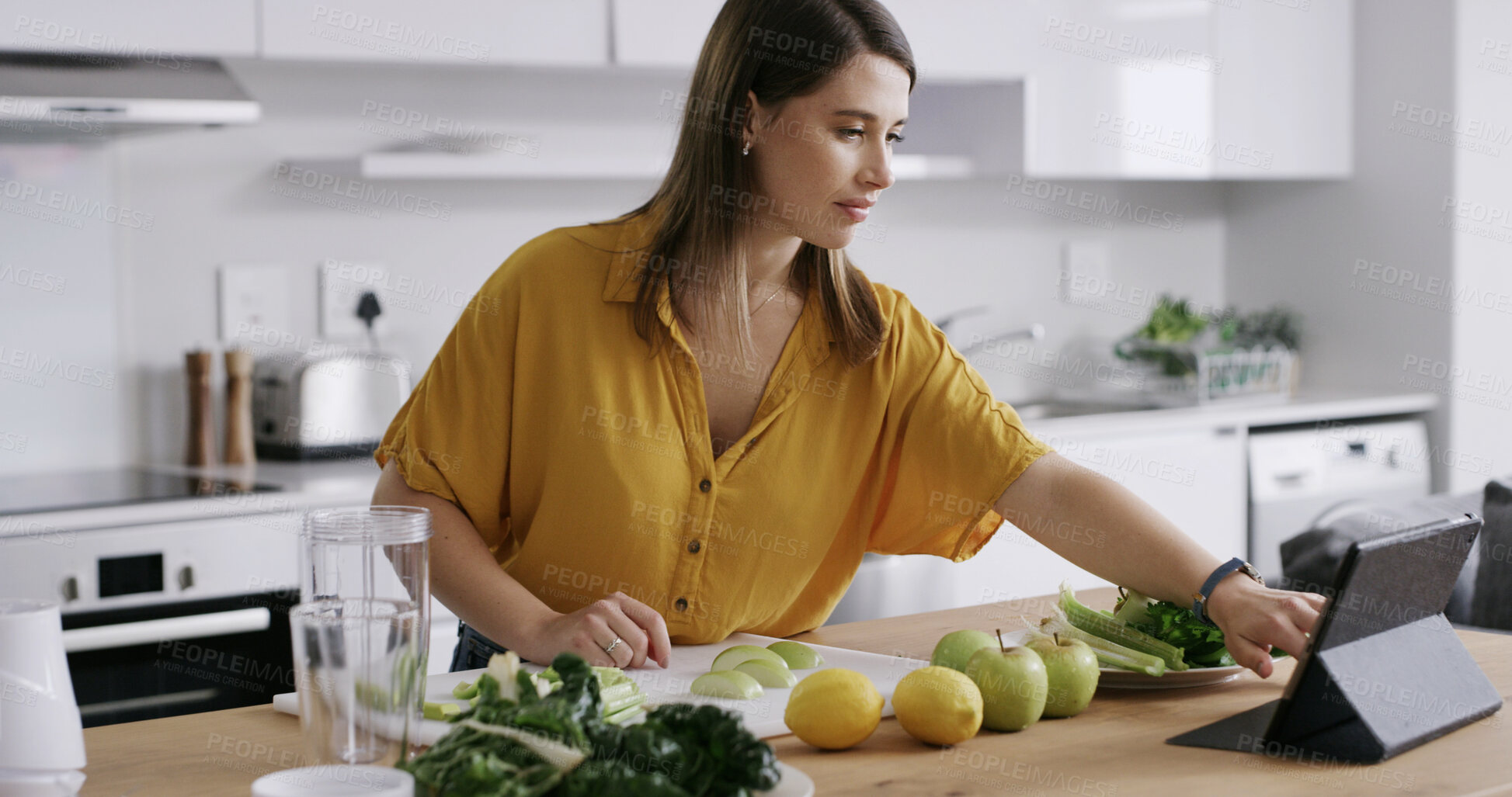 Buy stock photo Tablet, woman and fruit in home for breakfast drink, healthy diet and green smoothie. Person, blender and technology in kitchen to prepare ingredients, meal prep or nutrition shake for weigh loss