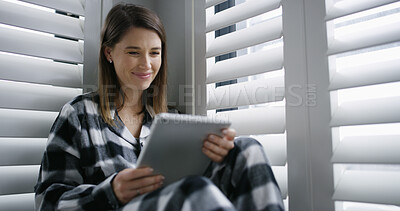 Buy stock photo Tablet, smile and woman in bedroom in home with social media, networking or reading blog. Digital technology, happy and female person with texting for communication on app in apartment on weekend.