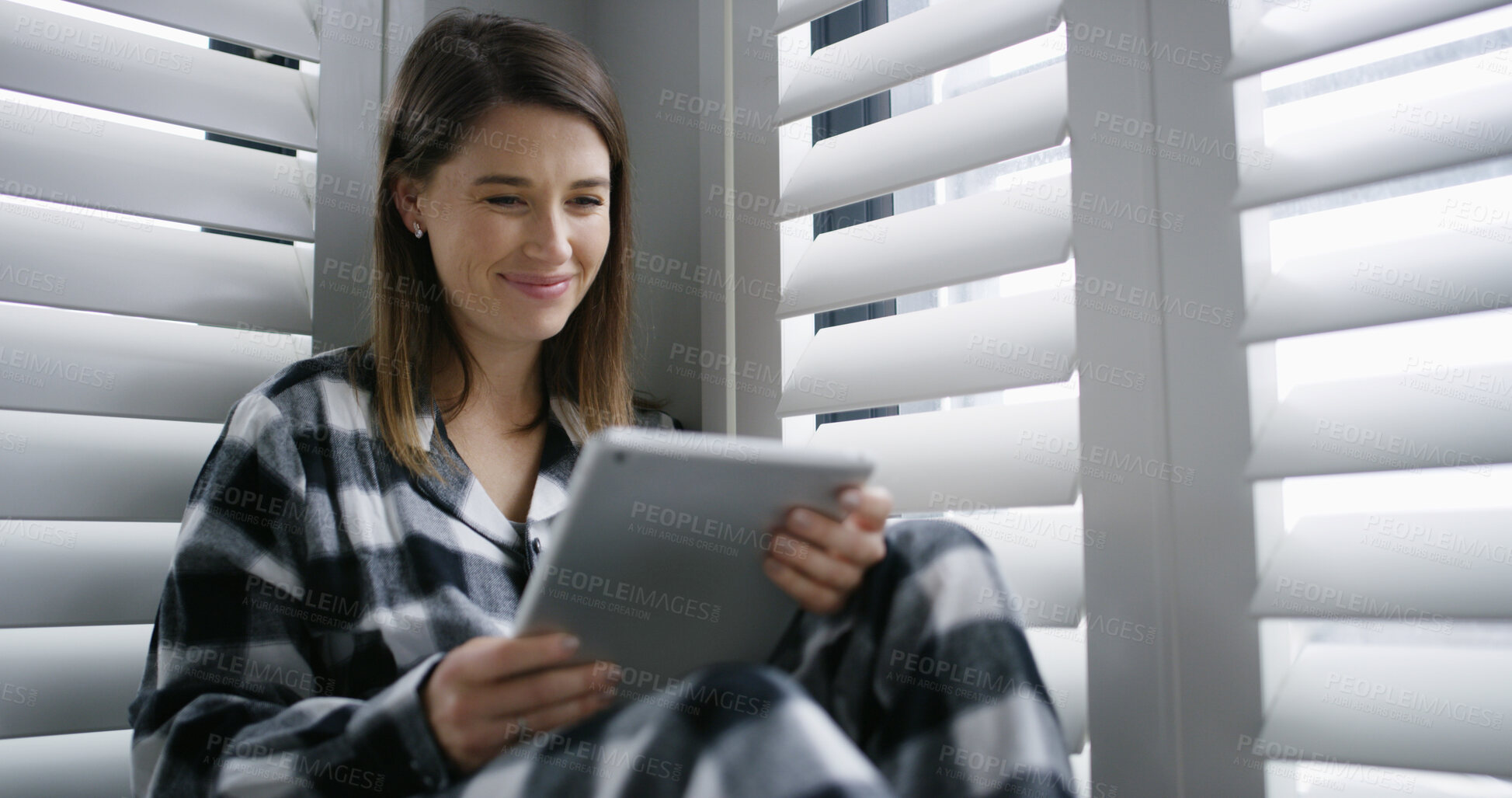 Buy stock photo Tablet, smile and woman in bedroom in home with social media, networking or reading blog. Digital technology, happy and female person with texting for communication on app in apartment on weekend.