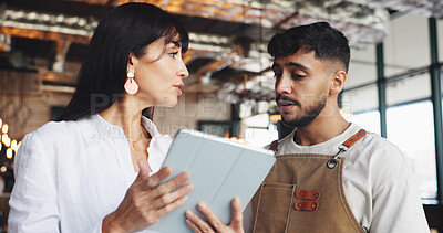 Buy stock photo Restaurant owner, man and meeting with tablet for inventory checklist, staff schedule or review supplier info. Woman, waiter and boss on digital tech for menu planning, coffee shop agenda or budget