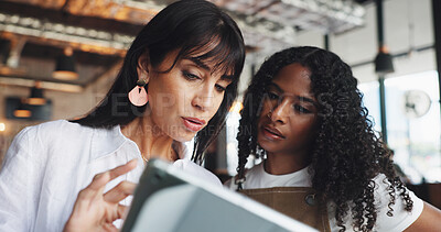 Buy stock photo Restaurant owner, waitress and meeting with tablet for inventory checklist, staff schedule or review supplier info. Women, server and boss on tech for menu planning, coffee shop agenda or budget