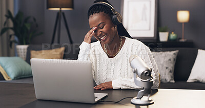 Buy stock photo Laughing, podcast and laptop with black woman in home for subscription goal, social media and brand endorsement. Content creation, microphone and broadcast editing with person in apartment for joke