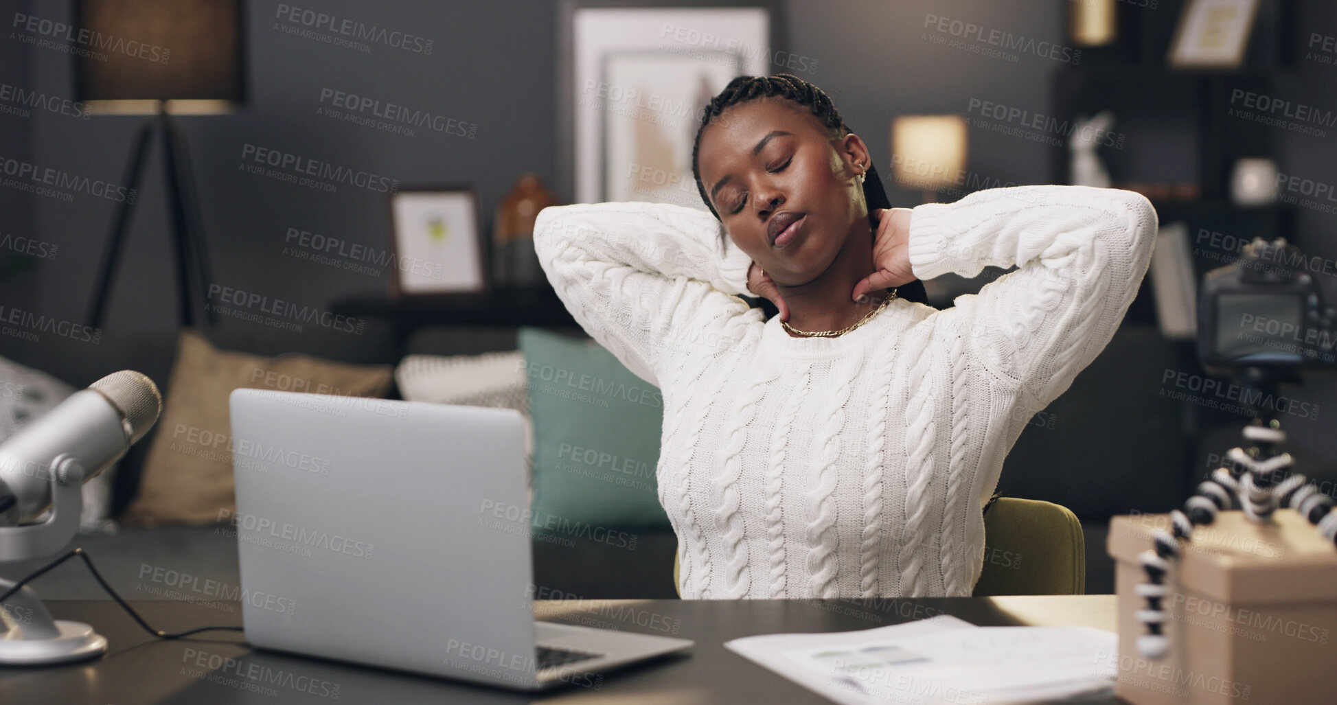 Buy stock photo Content creator, neck pain and black woman with laptop in home for stress, streaming deadline and pressure. Night, remote work and person with tension, muscle strain and fatigue for podcast career