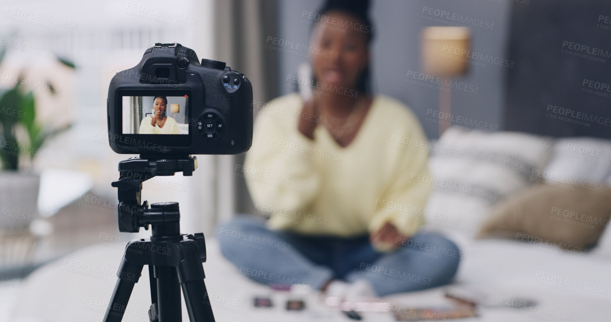 Buy stock photo Influencer, live streaming and woman with camera in home for product review, beauty tutorial and feedback. Content creator, social media and person in bedroom with cosmetics for testing on broadcast