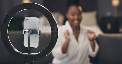 Buy stock photo Phone, ring light and recording with influencer in home for content creation, post or video on web. Person, smartphone and production for social media, live streaming or app in lounge at apartment