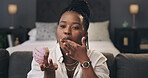 Black woman, night or portrait with donut for online food review, tips or dessert in home. Female person, influencer or vlogger in late evening or POV with sweet snack for advice or rating in house