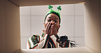 Surprise, opening and pov of black woman with box for present, gift and package for St Patricks day. Shamrock, below and portrait of person with parcel for shock, wow and excited for celebration