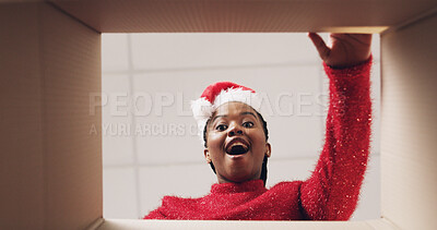 Buy stock photo Christmas, box and pov of black woman with surprise for present, gift or package for festive season. Opening, below and portrait of person with parcel for shock, wow or omg for celebration or holiday