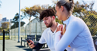 Buy stock photo Conversation, phone and sports tracking with friends outdoor for fitness or skills development. App, exercise and  health tracker with people speaking on tennis court for mobile progress update