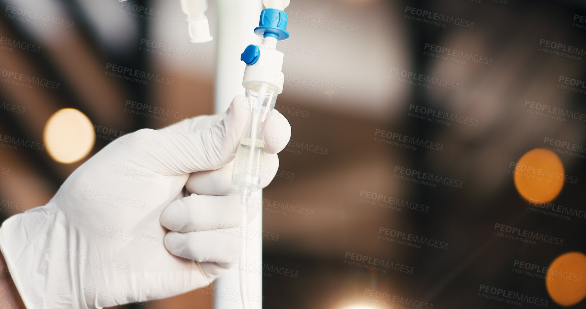 Buy stock photo Doctor, hands and iv drip in clinic with gloves, medicine dose or check fluid for hydration benefits. Bokeh, healthcare person and intravenous tube with liquid for supplements, nutrients or vitamins.
