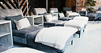 Interior, lounge sofa and wellness clinic for comfort, ambiance and peace in empty treatment room. Minimalist aesthetic, cozy or luxury chair for calm spa experience with candles, textures or design
