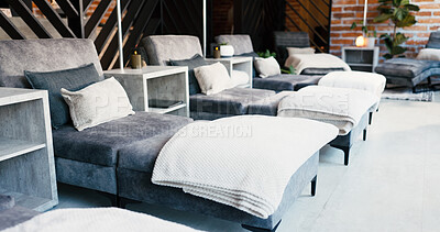 Buy stock photo Interior, lounge sofa and wellness clinic for comfort, ambiance and peace in empty treatment room. Minimalist aesthetic, cozy or luxury chair for calm spa experience with candles, textures or design