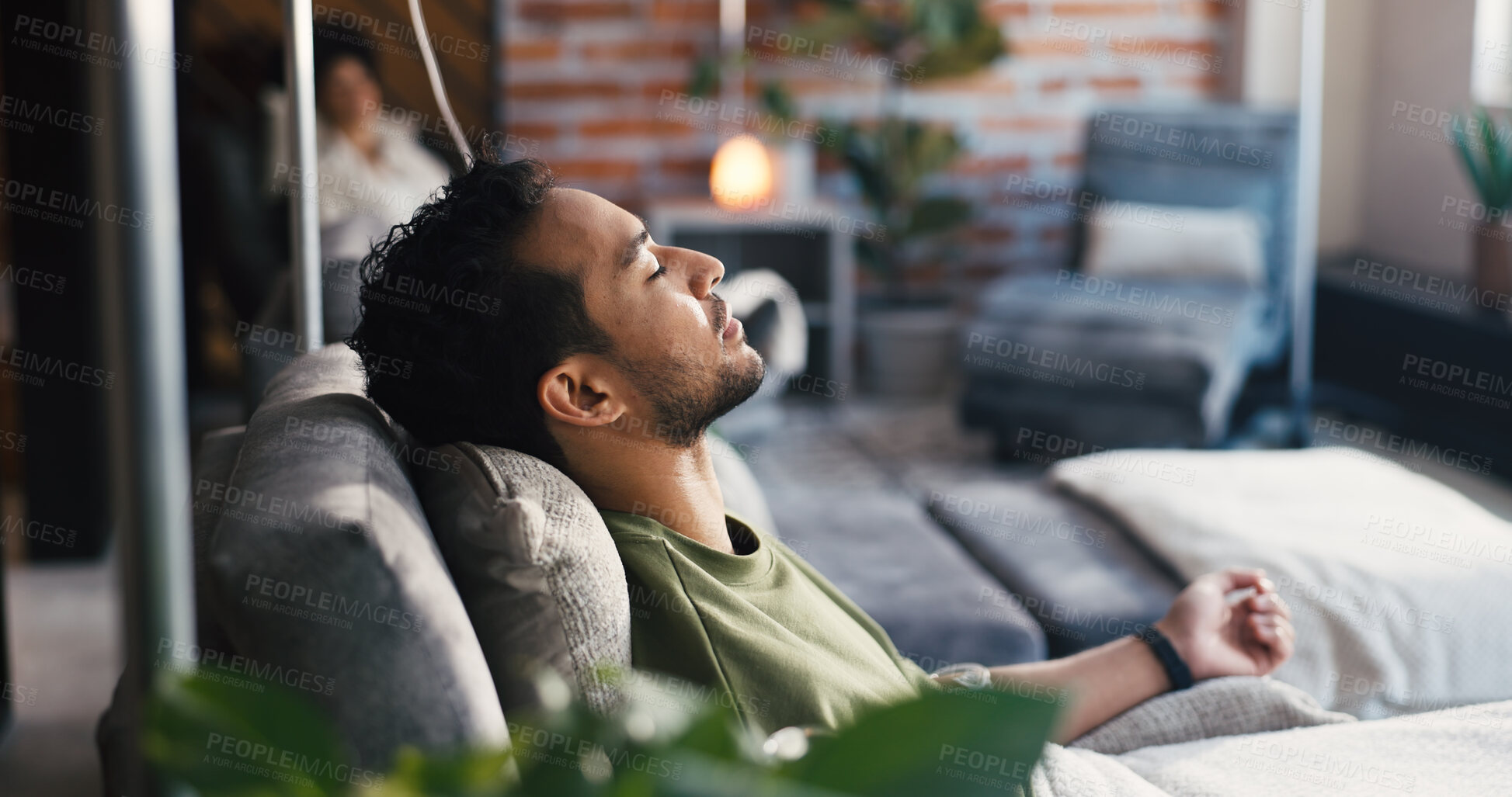 Buy stock photo Man, sleep and iv drip in clinic for healthcare, iron infusion and immune booster on couch. Male patient, rest or intravenous solution in medical lounge for treatment, hydration therapy or body detox