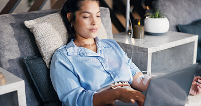 Buy stock photo Woman, relax or laptop with IV drip for healthcare, iron infusion or review services online. Person, tech or typing in medical lounge with immune booster, mineral therapy or research vitamin benefits