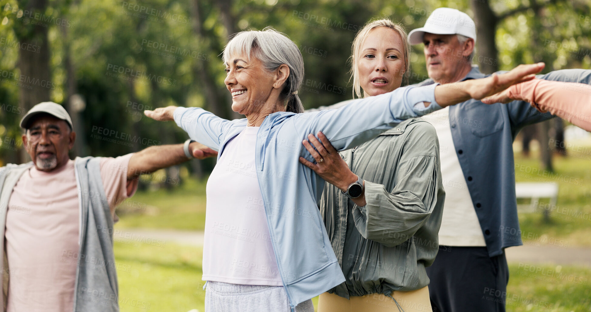 Buy stock photo Stretching, help and class with old woman in park for learning, mobility exercise and health club. Muscle warm up, wellness and balance with senior people for low impact workout and instructor