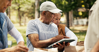 Buy stock photo Mature man, volunteer and tablet outdoor for charity, online checklist and community service. People, parcel and digital with donation inventory, humanitarian outreach and ngo schedule for food drive