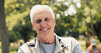 Portrait, smile and senior man in park, confidence and hobby for afternoon routine. Outdoor, pensioner and elderly person with happiness, natural bokeh and retirement plan for activity in Canada