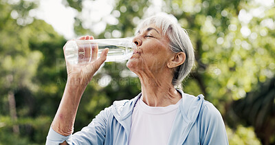 Buy stock photo Water, drinking and senior woman in nature for relax with fitness, training or exercise in park. Bottle, wellness and elderly female person in retirement with hydration beverage for workout break.