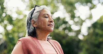 Buy stock photo Thinking, walk or old woman in park with breath, fresh air or reflection in retirement hobby. Wellness, bokeh or female person in nature with stroll, daydreaming or mindfulness in senior activity.