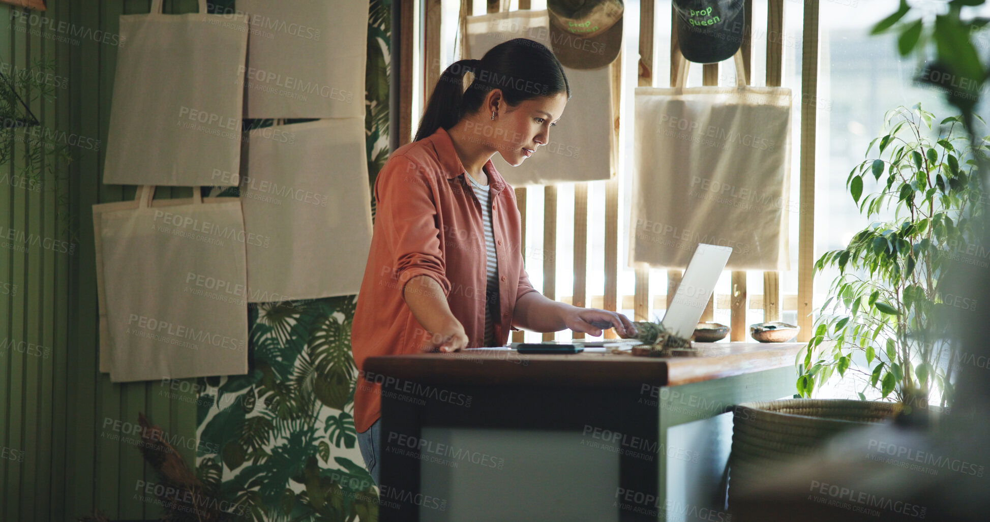 Buy stock photo Reading, laptop and plant with woman in store for delivery checklist, email and botany review. Order confirmation, sustainability and entrepreneur with person and tech in eco friendly small business