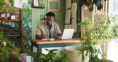 Buy stock photo Laptop, writing and plant with black man in store for delivery checklist, account report and botany review. Order confirmation, ecommerce and florist entrepreneur with person in small business