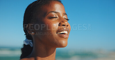 Buy stock photo Black woman, peace and sunshine at beach with relax, calm and meditation for self care. Summer, female person and zen at ocean with mindfulness, fresh air and mental health wellness in nature