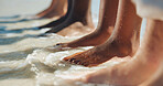 Peace, water and feet of friends at beach for summer vacation, tropical adventure and calm. Travel destination, tourism and holiday with group of people in ocean outdoor for waves, sea and break
