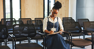 Buy stock photo Conference hall, black woman or writing in book for planning, presentation preparation or editing speech. Trade show, business seminar or guest speaker with phone for research, improvement or change