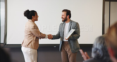 Buy stock photo Handshake, audience and speaker with award for presentation, business conference or event. People, shaking hands and prize announcement for workshop, achievement or recognition and career development