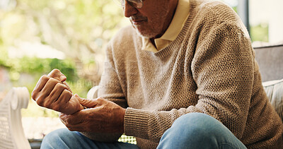 Buy stock photo Hands, sofa and wrist pain in home, injury and senior man in lounge with joint inflammation. Elderly person, frustrated and muscle fatigue for carpal tunnel, tendinitis or stress for strain at house