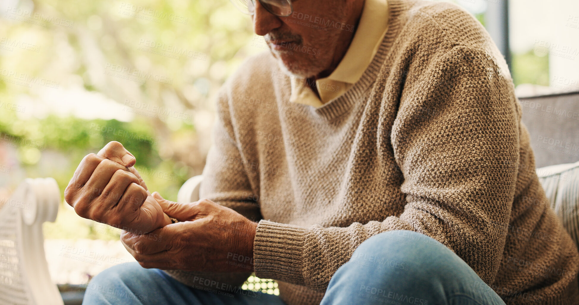 Buy stock photo Hands, sofa and wrist pain in home, injury and senior man in lounge with joint inflammation. Elderly person, frustrated and muscle fatigue for carpal tunnel, tendinitis or stress for strain at house