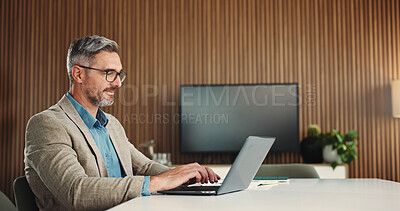Buy stock photo Office, laptop and man with glasses, typing and research for risk assessment or budget review on web. Business, financial analyst and mature person with tech for wealth management, online and report
